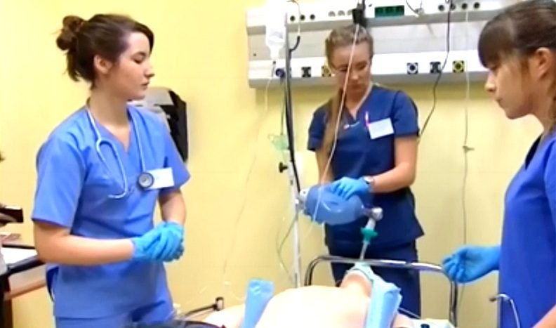 Medical students practice in medical simulation rooms